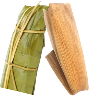 Tamales wrapped in banana leaf and corn husk